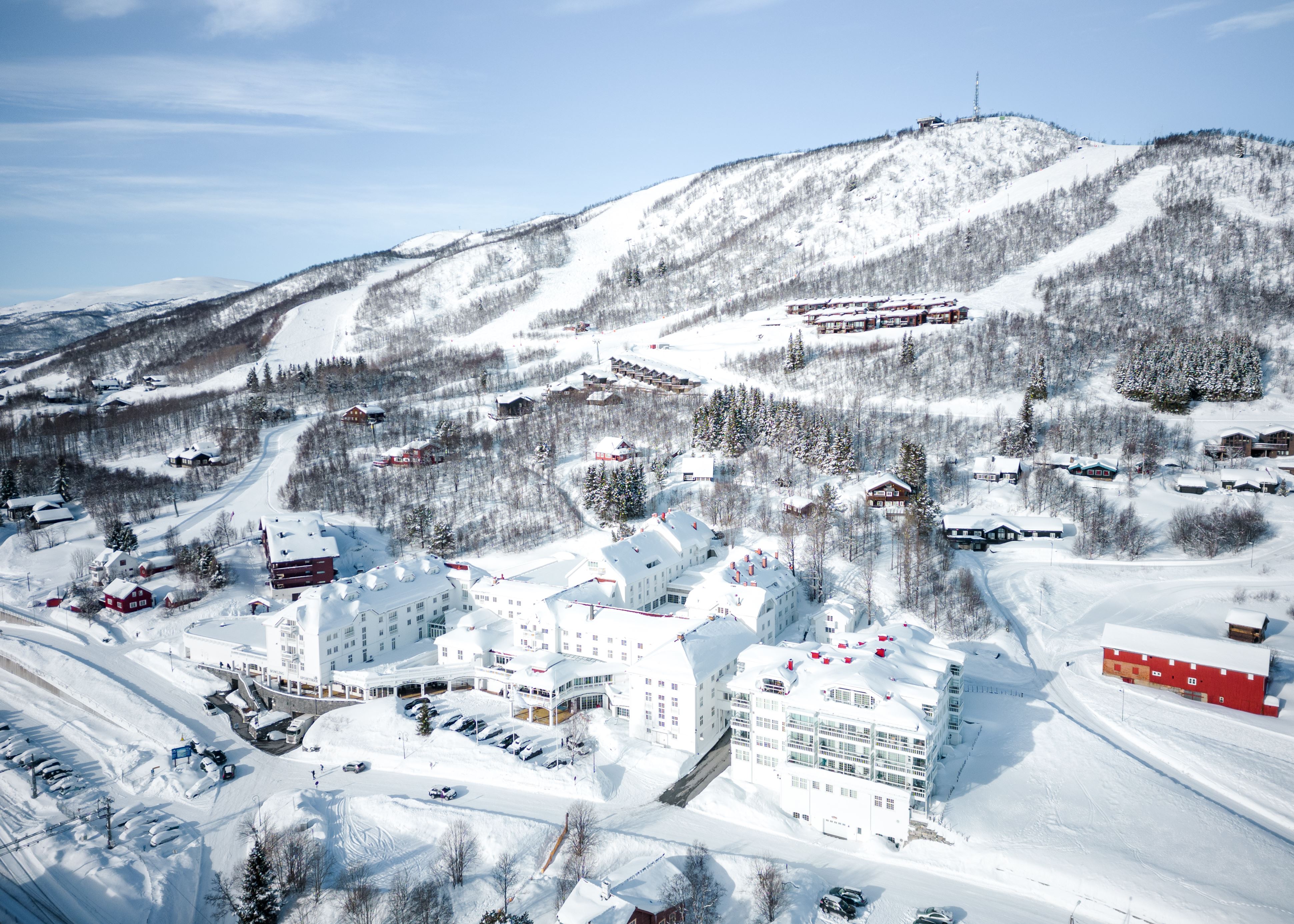 Snow-covered mountains and buildings in Geilo, Norway